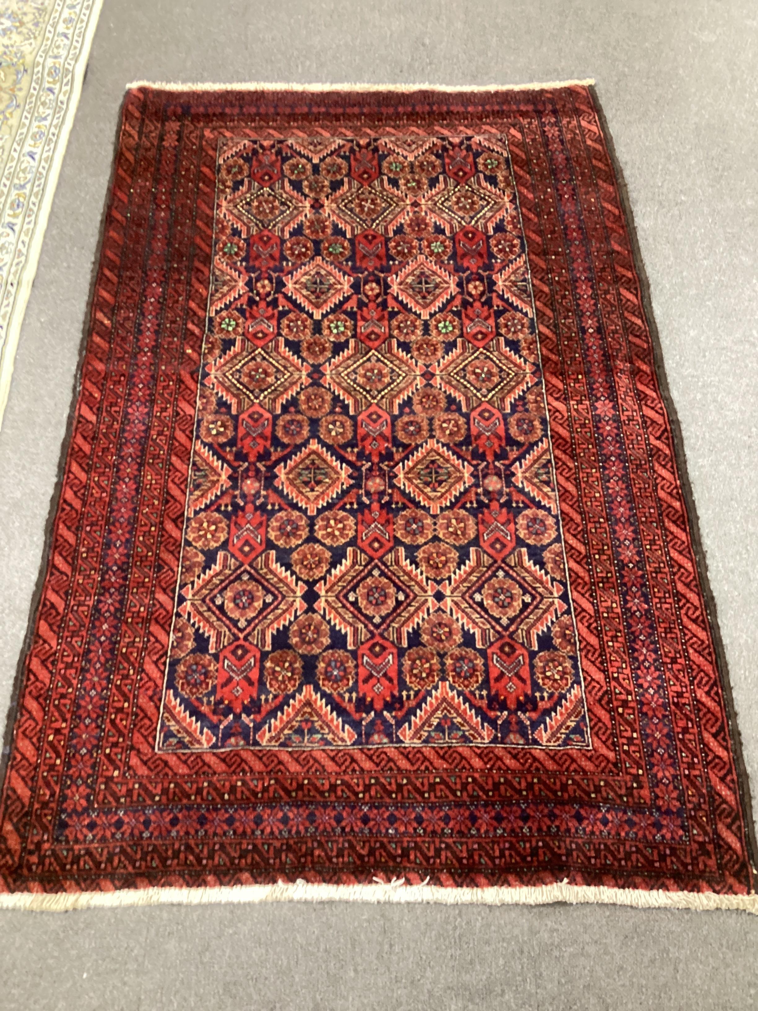 A Belouch blue ground rug, 170 x 106cm